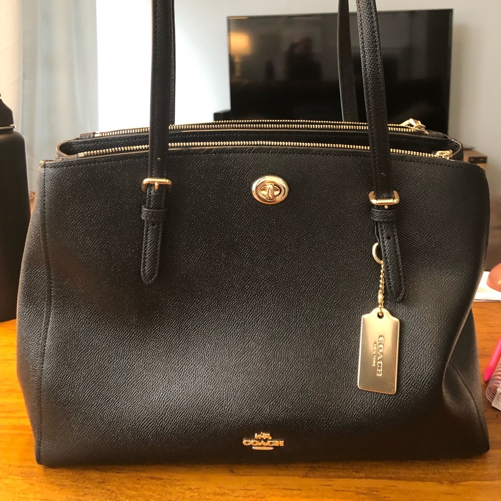 Black leather coach bag. Fits an 8x11 notebook.